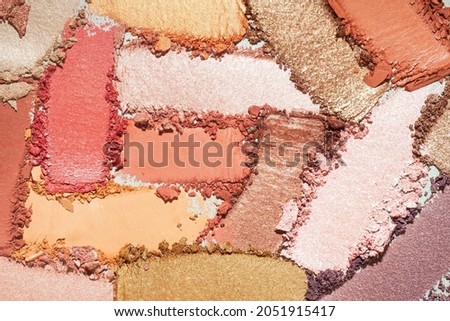 Eye shadow multi colored brown beige, orange, golden, pink smudge loose gray isolated background Royalty-Free Stock Photo #2051915417