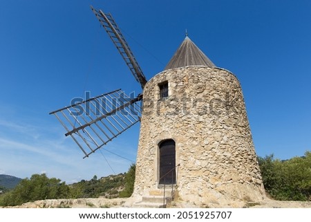 The Moulin Saint-Roch, windmill located in the commune of Grimaud, in the French department of the Var. Royalty-Free Stock Photo #2051925707