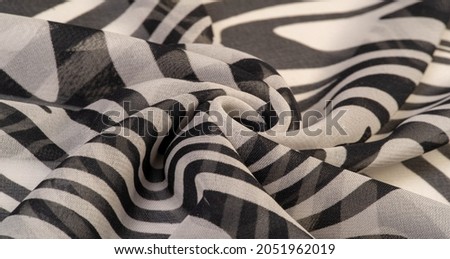 silk fabric, black and white abstract lines. The magical shape of an abstract black and white pattern. Retro modern decor, textile art, design, texture, background, pattern