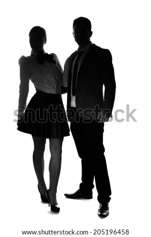 Silhouettes on white of a stylish couple standing side by side looking at the camera, woman in a miniskirt and high heels and man in a suit