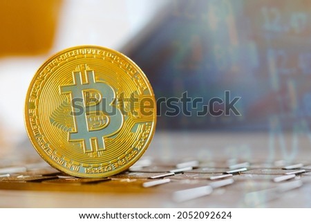 In this photo illustration a Bitcoin coin. It is a decentralized cryptocurrency, being an electronic money for point-to-point transactions