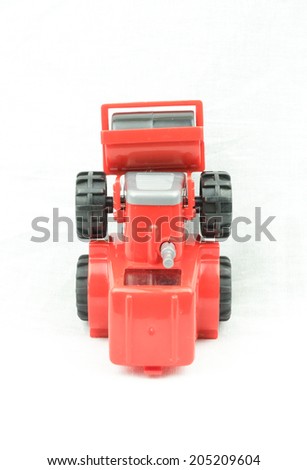 Heavy Construction Machinery Toy: Red steam roller machine for asphalt.
