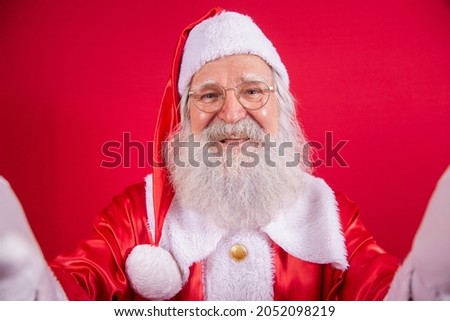 Santa Claus making selfie photos. Christmas night. Gift delivery. Enchanted dreams of children.

