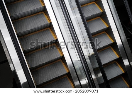 escalator in a shopping center. automatic escalator in the subway Royalty-Free Stock Photo #2052099071