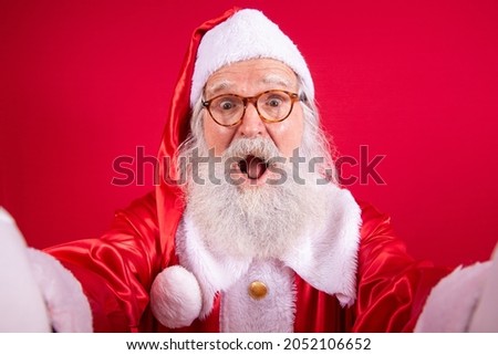 Santa Claus making selfie photos. Christmas night. Gift delivery. Enchanted dreams of children.
