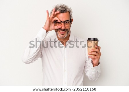 Middle age business man holding a take away coffee isolated on white background  excited keeping ok gesture on eye.