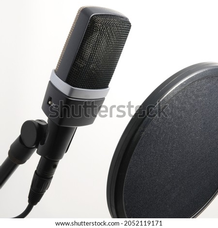 Large Diaphragm Professional Condenser Microphone with Pop Filter Facing Right for Singers and Broadcast Announcers