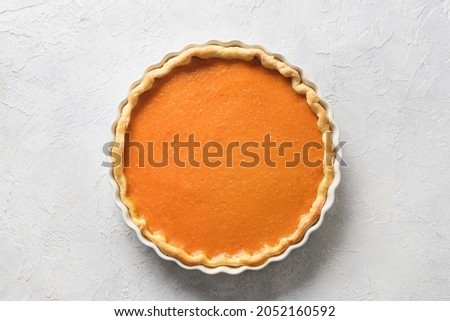 Traditional American Pumpkin Pie isolated on white background. View from above. Homemade pastry for Thanksgiving Day.