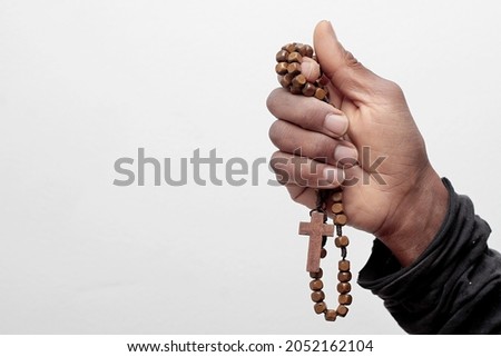 hand holding the Cross with white background stock photo Royalty-Free Stock Photo #2052162104