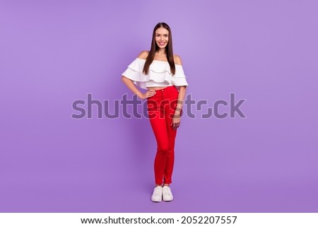 Photo of charming pretty positive lady hands hips wear white blouse pants isolated violet color background