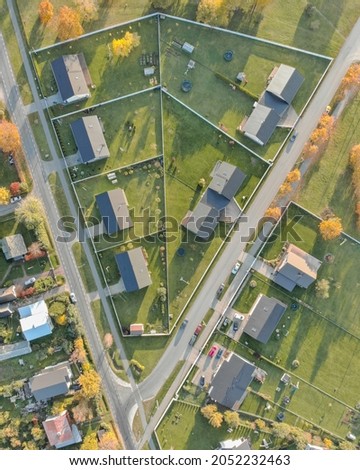 Drone images of Raasiku village located in Estonia. Aerial photos of new real estate neighborhood. Patterns from above. Urban district in residential area of small normal village in Estonia