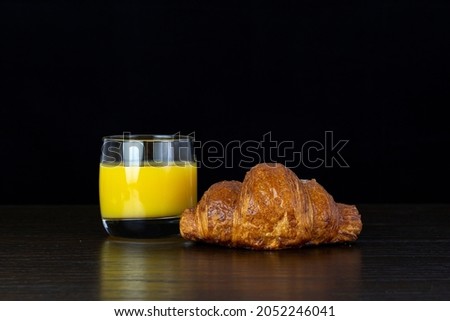 Fresh Croissant For Healthy Breakfast. Studio low key food against a dark background.