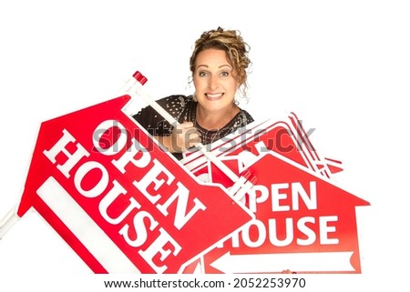 Excited real estate agent holding multiple Open House signs