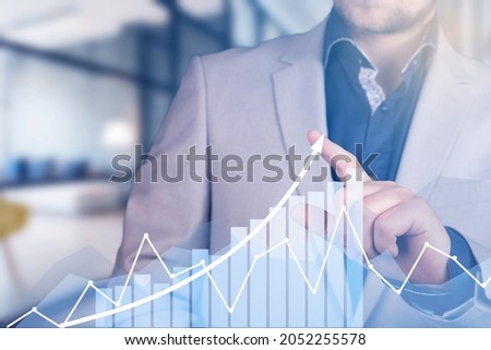 Development and growth concept. Businessman plan growth and increase of positive indicators in his business. High quality photo