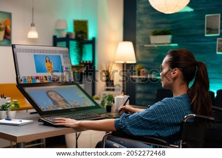 Photography production artist doing retouch work at office studio using professional equipment keyboard digital tablet stylus computer monitor. Editing woman working for retouching job