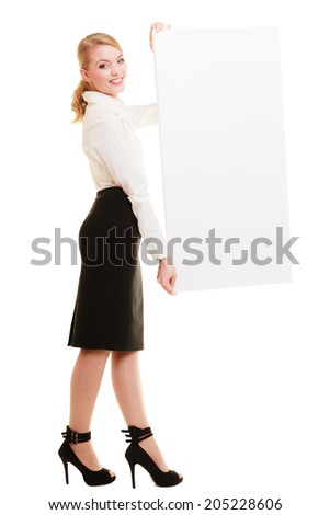Advertisement. Elegant young woman holding blank copy space banner isolated on white. Businesswoman recommending your product.