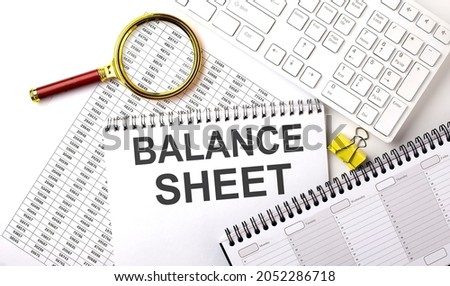 BALANCE SHEET text written on notebook on chart with keyboard and planning