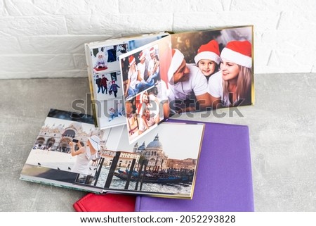 Banner Photobook Album with Travel Photo on Wooden Table background