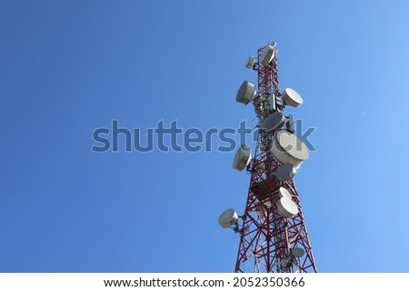 Base Transceiver Station or BTS or BTS Tower is a telecommunications infrastructure that facilitates wireless communication between communication devices and the operator's network. on blue sky
 Royalty-Free Stock Photo #2052350366