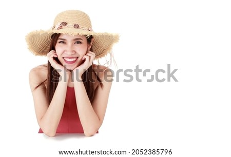 Asian beautiful woman wearing fashion red cloth, hat, pose and smiling while sitting on isolated white background cutout