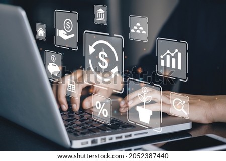 Businessman using a computer to Concept of fund financial investment management portfolio diversification Royalty-Free Stock Photo #2052387440