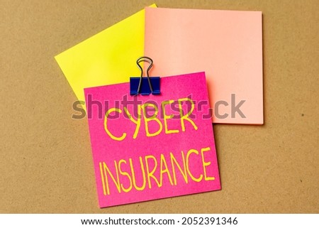 Text caption presenting Cyber Insurance. Business overview protect business and users from Internetbased risks Multiple Assorted Collection Office Stationery Photo Placed Over Table