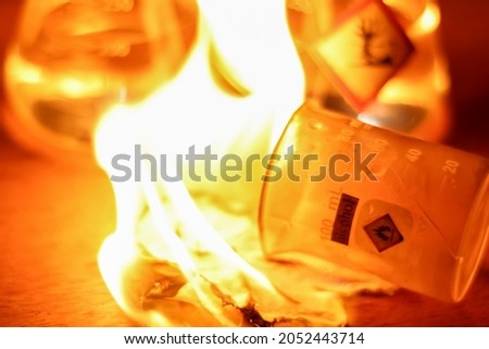 Chemical alcohol fire in the lab at night Royalty-Free Stock Photo #2052443714