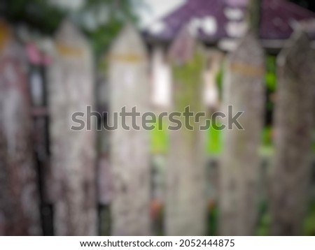 defocused abstract background of old faded ironwood fence in a house