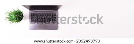 Stylized clean marble office working desk with smartphone, laptop, glasses and coffee cup, workspace design, mock up, top view, flat lay, copy space, close up