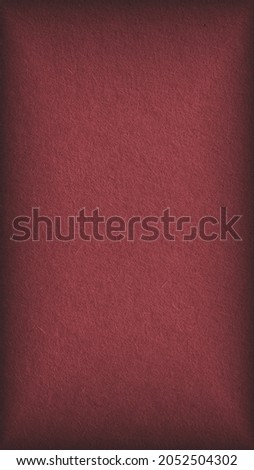 The surface of brown cardboard. Paper texture with cellulose fibers. Dark paperboard mobile phone wallpaper with vignetting. Vertical graceful and the home background. Textured backdrop. Macro