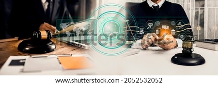 Lawyer hands working with digital tablet computer on wooden table office. Law innovation network interface icons, blurred background.