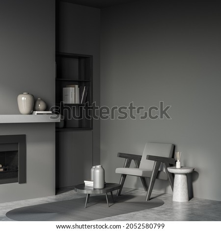 Dark living room interior with grey armchair and fireplace, grey concrete floor with carpet. Mockup blank wall with minimalist furniture, 3D rendering