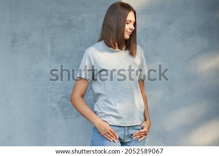 Young woman in gray shirt