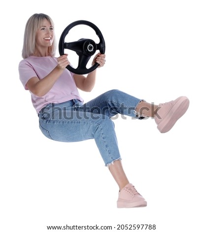 Happy woman with steering wheel on white background