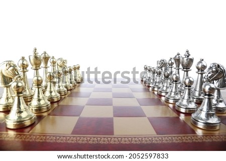 Chess pieces on wooden board against white background