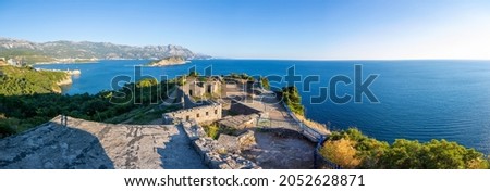 Ruins of medieval fortress Tvrdava Mogren at the shore of Adriatic sea, Budva, Montenegro. High quality photo