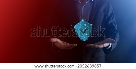 Businessman hold low poly polygon shield with a tick icon.Secure Access System Concept.Business Financial Warranty for Investment.antivirus concept.Technology security.Protection network,safe data Royalty-Free Stock Photo #2052639857