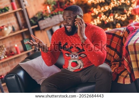 Photo of young afro man happy positive smile talk smartphone congratulation wish merry xmas december indoors