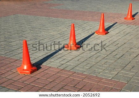 Red cones aligned in row