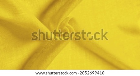 silk fabric in yellow. texture, dense, Abstract smooth silk fabric. beautiful bend. close-up. - Image