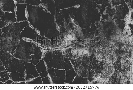 Dark gray cracks and wrinkled creases on old grainy paper in black