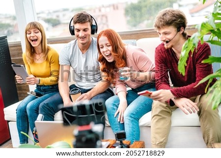 Young friends influencer having fun on streaming platform with web cam - Content marketing concept with millennial guys and girls sharing live vlog feeds on social media network - Bright vivid filter