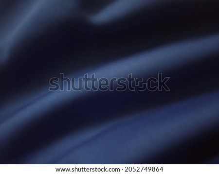 Abstract blurred black fabric material textile texture  pattern background for design or advertising product, canvas cloth woven backdrop