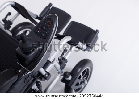 Motorized Electric wheelchair for senior elder patient who cannot walk, isolated. Elderly woman man go outside home hospital, free outdoor travel as disabled. clipping path white background Royalty-Free Stock Photo #2052750446