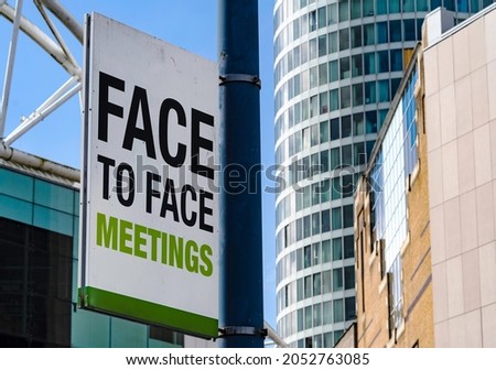 Face to Face meetings sign in Downtown city setting