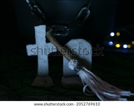 Halloween graveyard witches broom on dark background medium shot