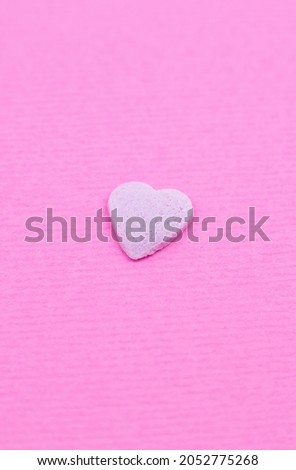 Pink heart on pink background. Saint Valentine's day concept. Love and romantic photo. Postcard for holiday. Beautiful warm wallpaper with love. Soft focus. Copy space.