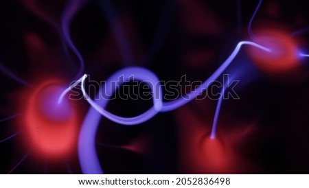 Plasma being formed by voltage in a vacuum of noble gases, close-up, macro.