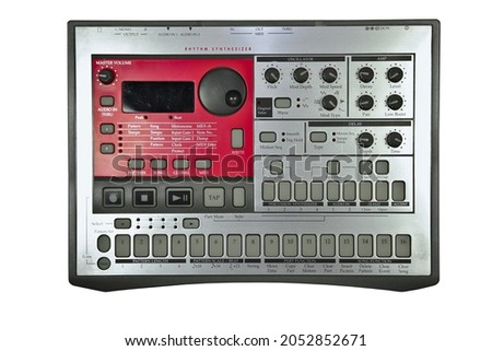 Vintage analog silver and red electronic drum machine sequencer. Flat perspective, isolated on white background  Royalty-Free Stock Photo #2052852671