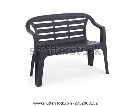 Gray Plastic Chair Against White Background
